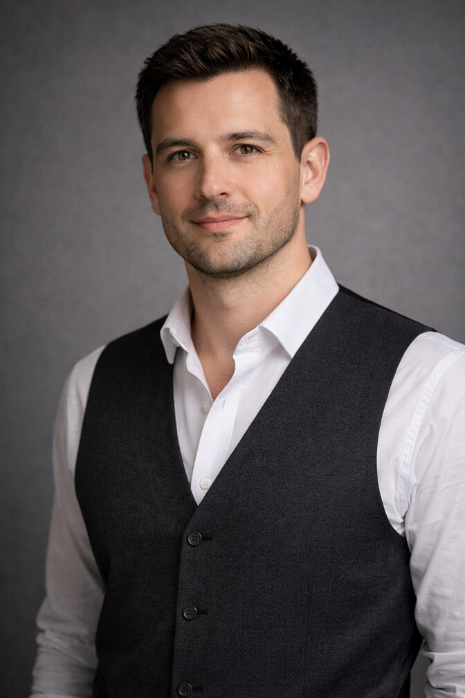 Professional headshot with a tailored vest over a dress shirt