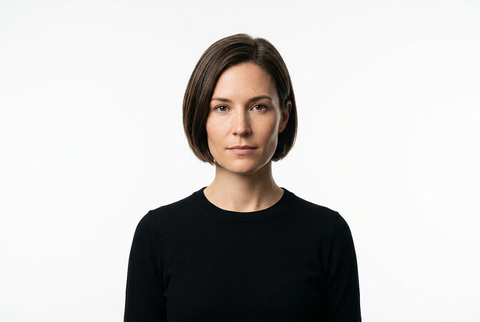 Minimal modern headshot style with single color background clean lines and focus on the subject with no visual distractions