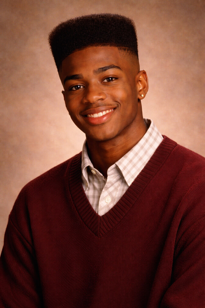 AI-generated 90s yearbook portrait of a young man in a sweater against a vintage studio backdrop