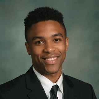 AI-generated yearbook headshot of a male with blurred green gradient backdrop.
