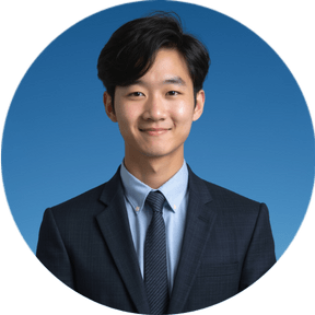 professional headshot of a man with blue background