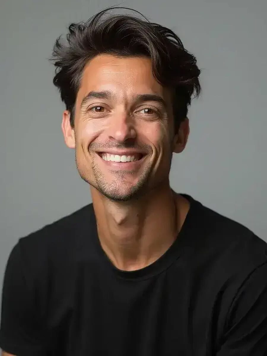 AI-generated CV photo example: man in a black crew-neck sweater smiling against a plain grey background, business-casual CV picture