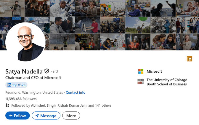 Professional LinkedIn photo example: Satya Nadella, tech CEO, in a blue blazer over a black t-shirt against a plain backdrop