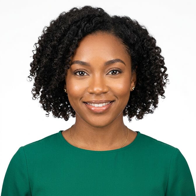 Deep green passport photo outfit example: woman in an emerald crew-neck top against a plain white background