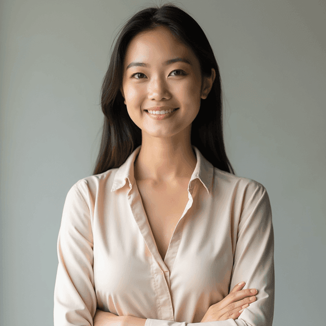 Female professional LinkedIn headshot in an elegant solid-colour blouse