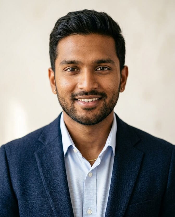 LinkedIn-ready headshot of a man with direct eye contact, tight framing, and a clean background, the signals recruiters scan for