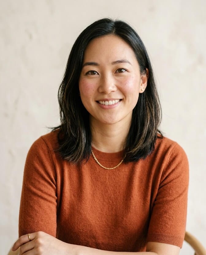 Natural, realistic AI headshot of a woman with warm skin texture and living eyes that clears the uncanny valley
