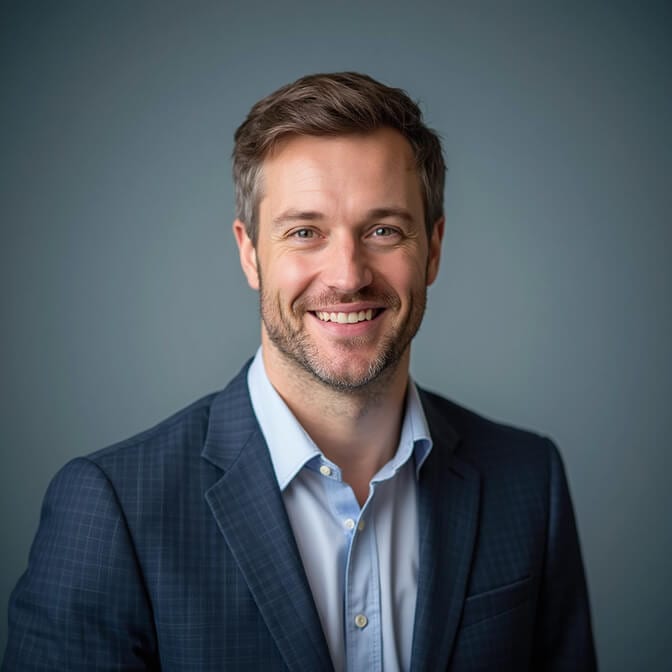 professional headshot on a gradient blue background
