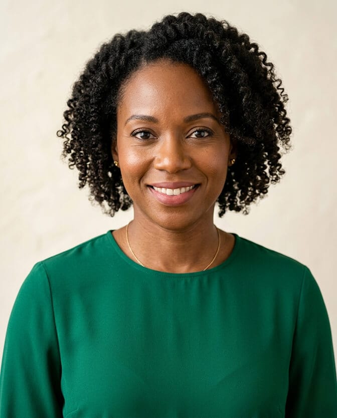 Grid of professional headshots of the same person in navy charcoal emerald and beige tops showing how each color changes how sharp and awake the face looks