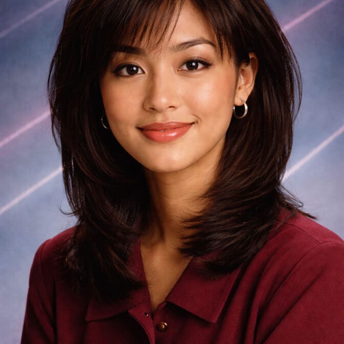 Realistic AI yearbook photo of a woman that clearly looks like her, styled in retro fashion