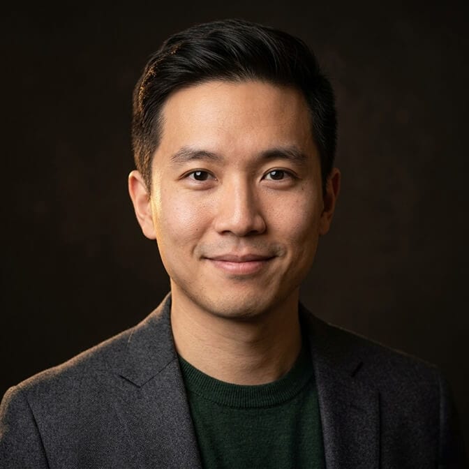Before and after of a flat white background headshot upgraded to a moody charcoal background