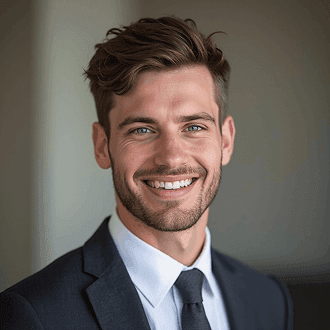 Passport style photo of a man in a suit against a plain grey background