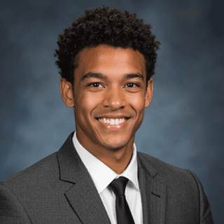 AI-generated yearbook headshot of a young man with curly black hair